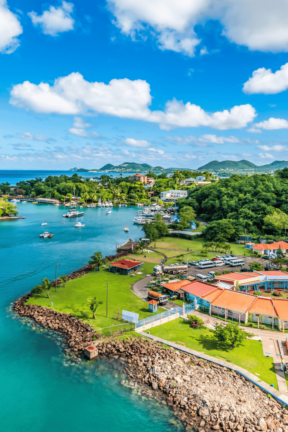 Scenic coastal marina with boats and lush greenery, perfect for travel and vacation planning.