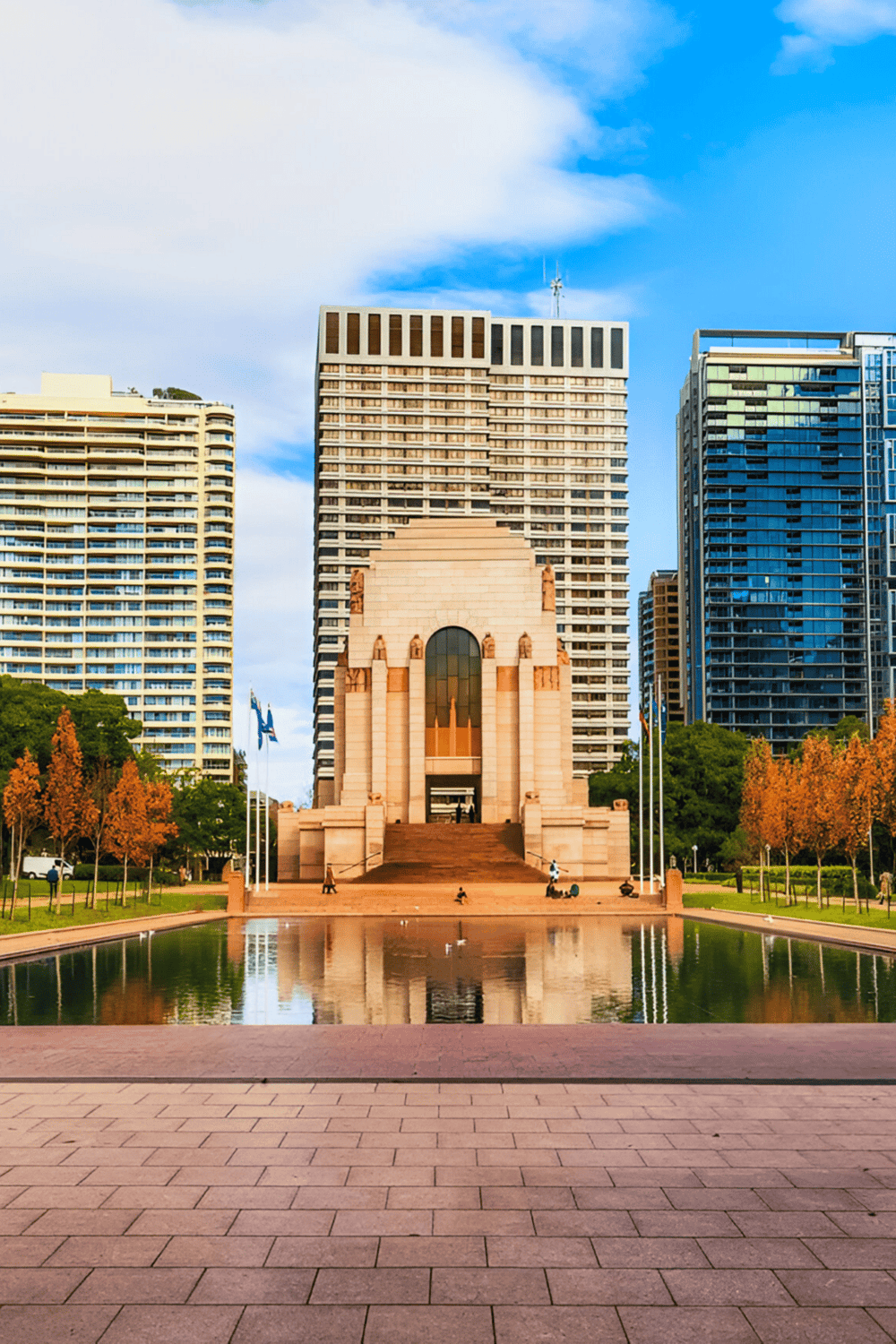 Historic city monument with modern skyscrapers in downtown park, showcasing urban navigation and foundational landmarks.