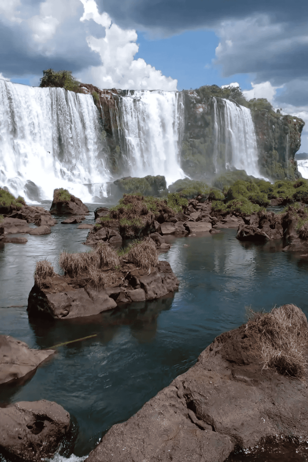 Vivid waterfall with cascading water and rocky landscape, ideal for adventure and nature exploration.