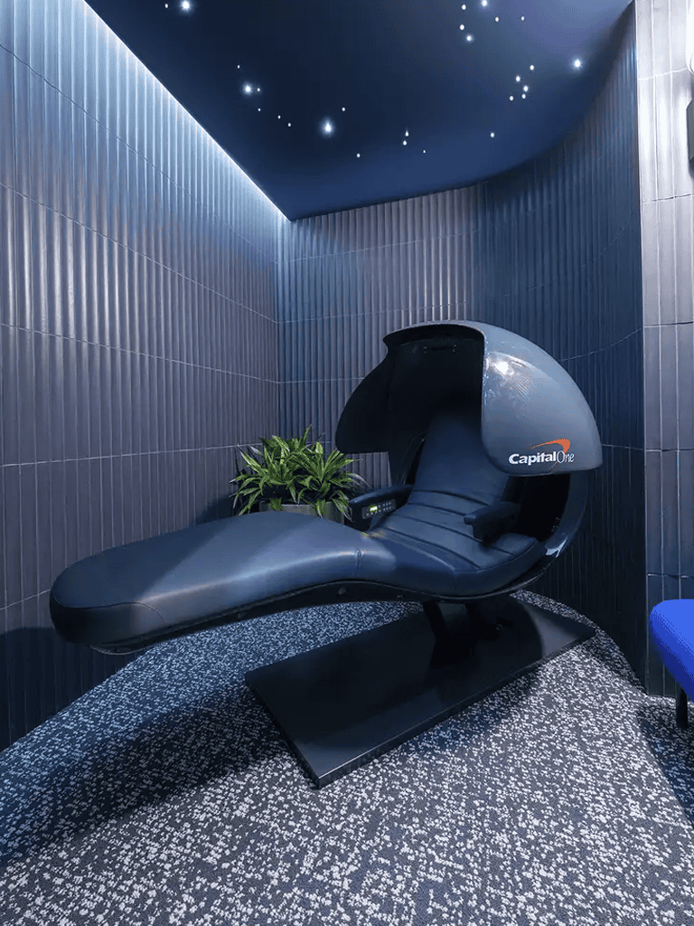 A futuristic relaxation pod at QuestForDirections office, blending innovation and comfort for improved wellness.