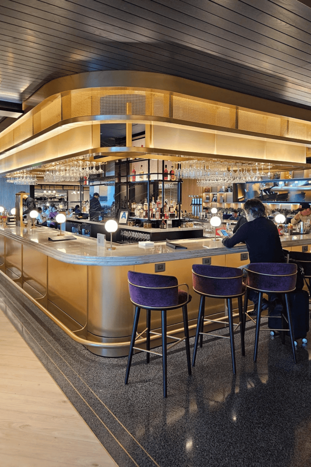 Bar and lounge area at Quest for Directions restaurant, modern decor, stylish seating and bar setup.