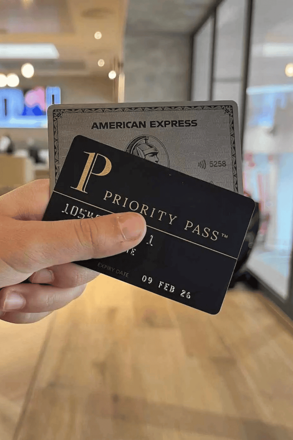 Priority Pass airport lounge access card and American Express credit card, travel convenience and premium airport experience.