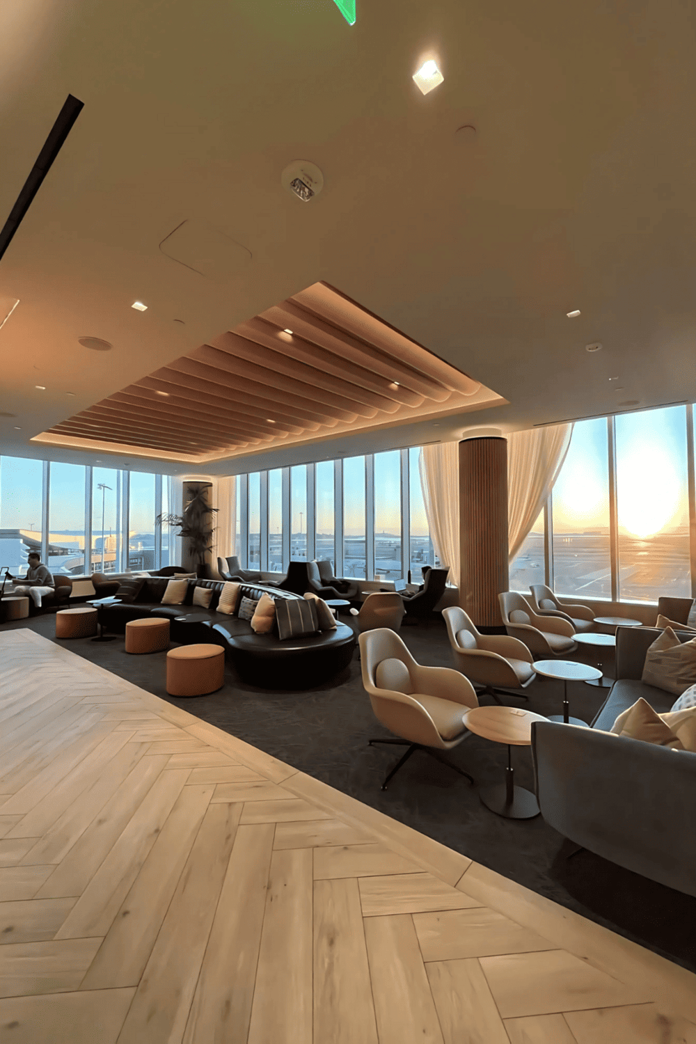 1. Modern airport lounge with comfortable seating and scenic city views.