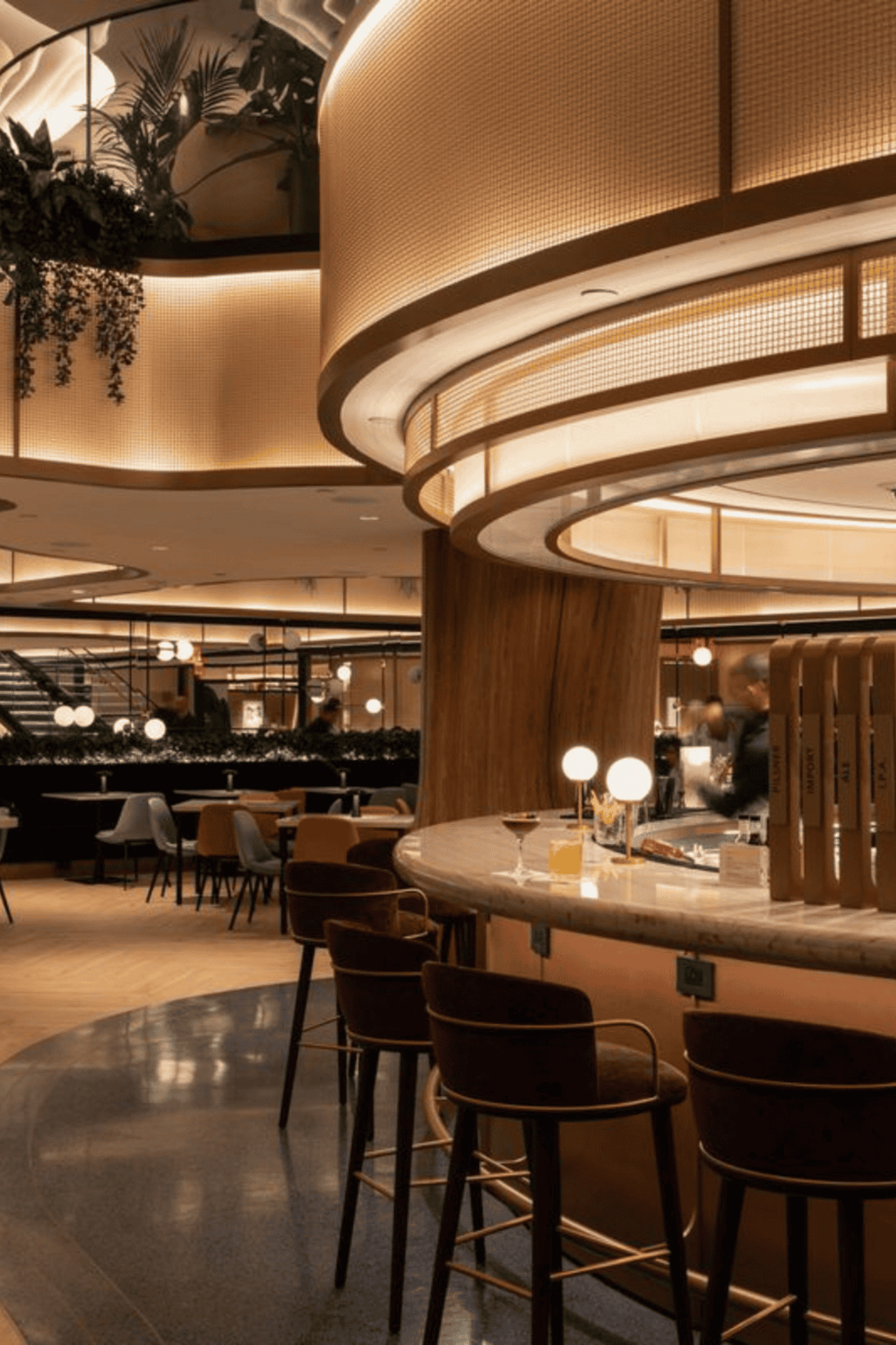 Cozy modern hotel lobby with warm lighting and stylish seating area.