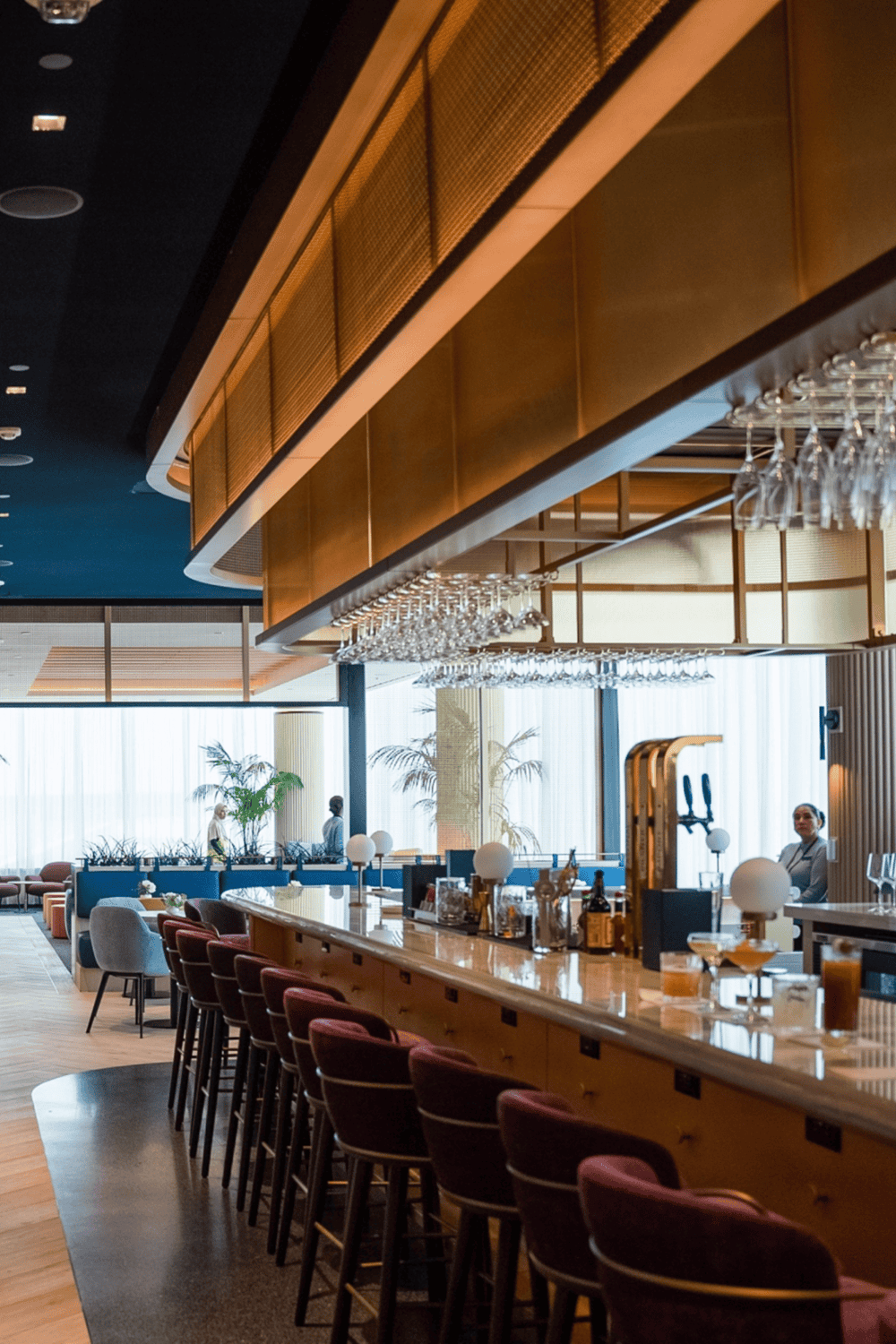 Modern hotel bar interior with stylish seating and elegant decor, perfect for relaxing and socializing.