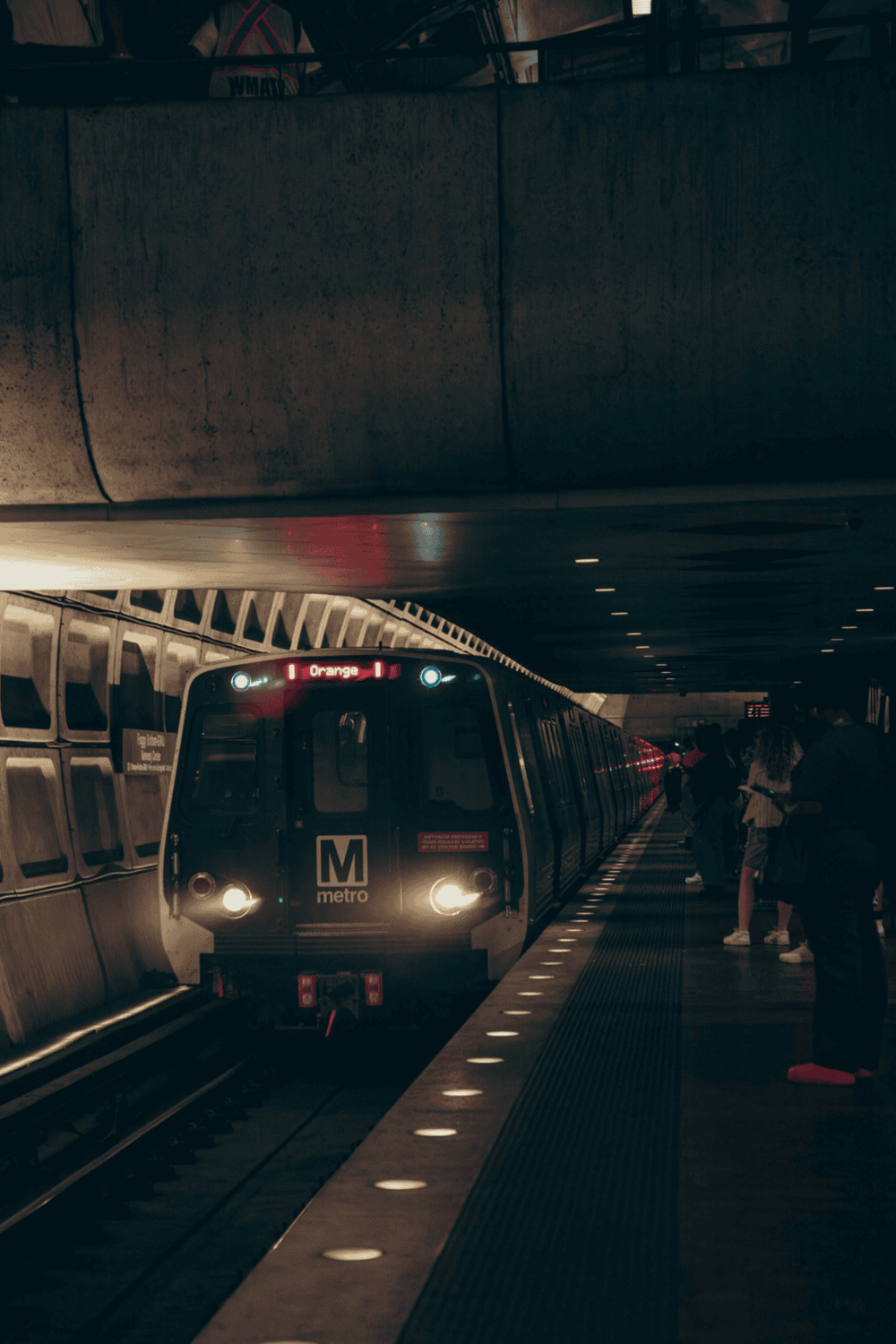 Subway train arriving at underground station, public transit transportation, metro service, urban travel.