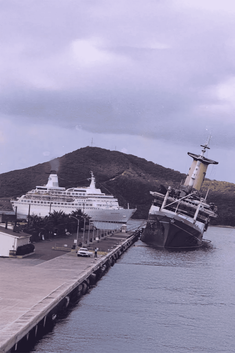 Dority shipwreck and cruise ships at harbor, QuestForDirections travel destination, maritime exploration, abandoned ship, scenic port view.
