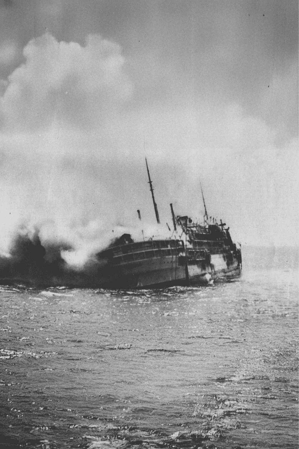Old black and white ship sinking in rough seas, historic maritime disaster scene.