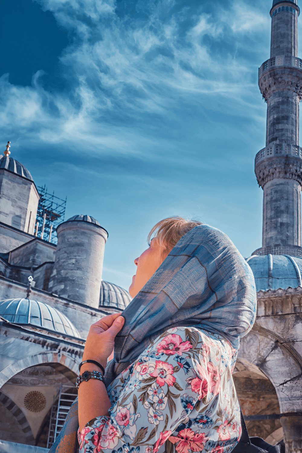 Ancient mosque with a woman wearing a hijab, exploring religious landmarks and cultural heritage.