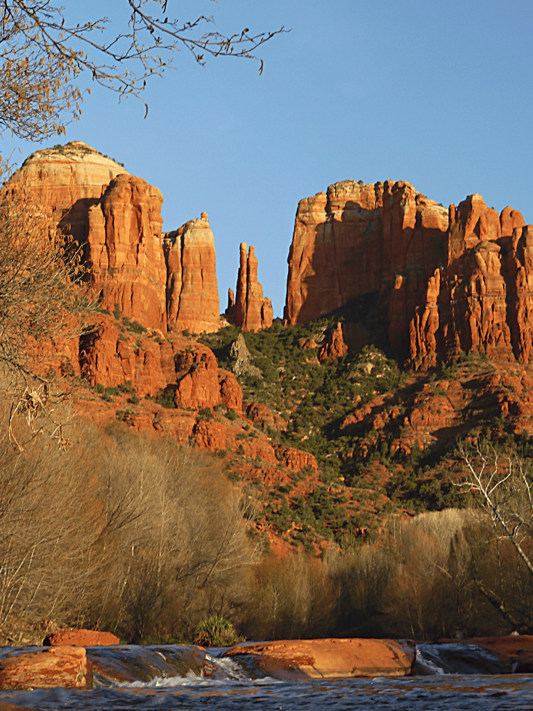 Red rock formations at Sedona, Arizona in clear blue sky, scenic landscape, Arizona travel destination.