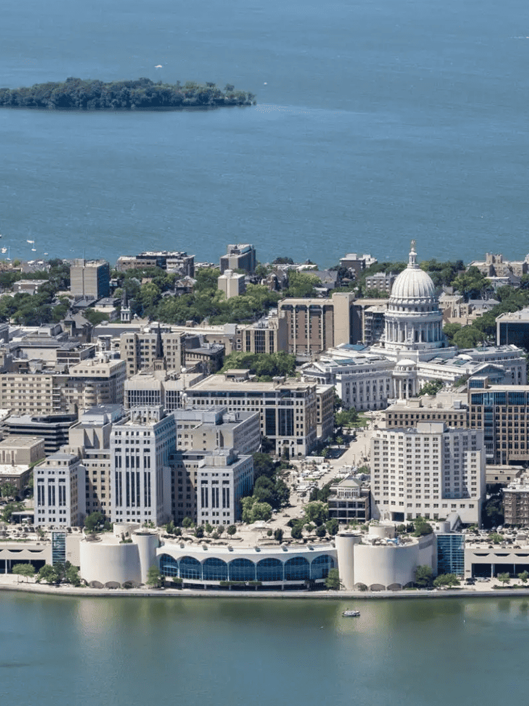 Aerial view of Madison, Wisconsin skyline with State Capitol and Lake Mendota.