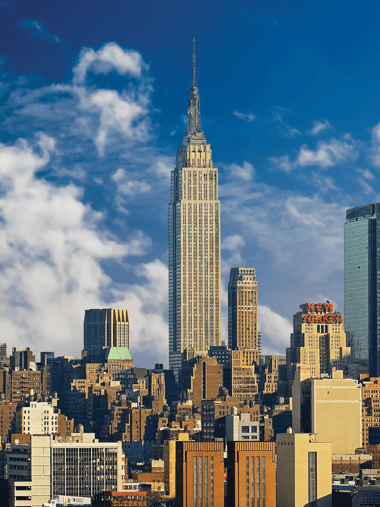Empire State Building skyline, New York City, tall skyscraper, cityscape, iconic landmark, urban architecture, tourism destination, NYC sightseeing, tall buildings, modern cityscape.