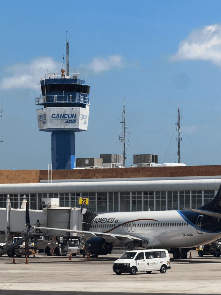 Control tower Cancun, Mexico airport, tourism, air traffic, aviation, travel, commercial airline, international flights, airport infrastructure, flight operations.