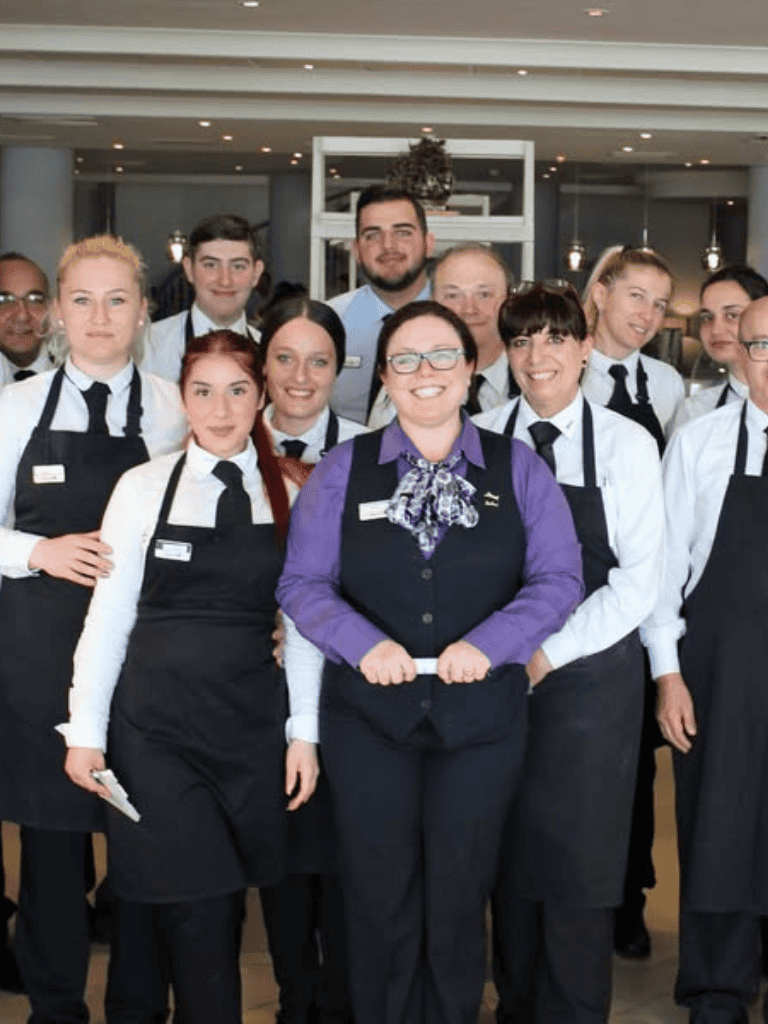 Friendly hospitality team at QuestForDirections restaurant.
