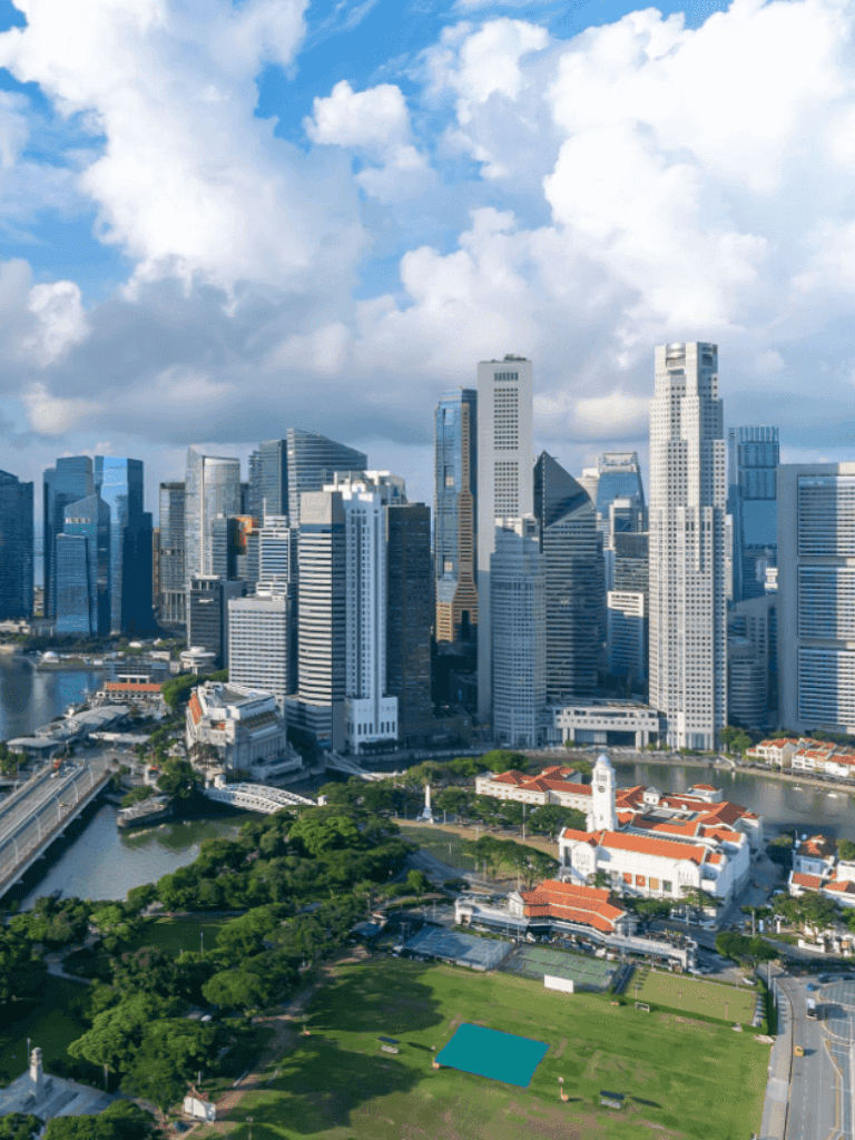 Modern city skyline with skyscrapers and waterfront view, highlighting urban development.