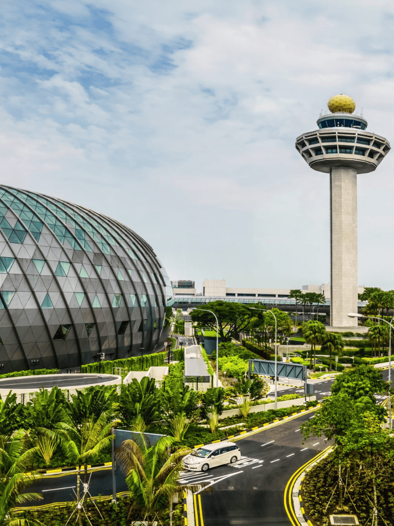 Modern airport control tower and futuristic architecture in Singapore.