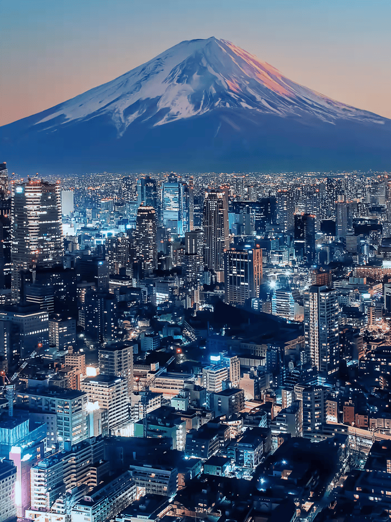 Vibrant Tokyo skyline with Mount Fuji at sunset, showcasing Japan's bustling city life and iconic mountain.