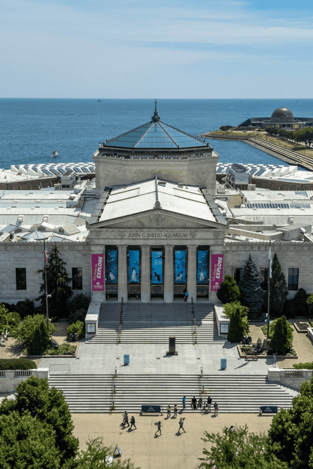 Historicbuilding with ocean view at Shedd Aquarium in Chicago, iconic destination for family fun and marine life exploration.