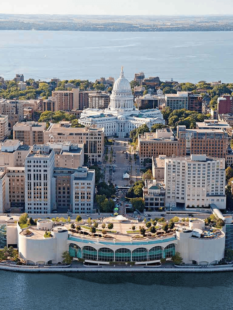 Modern cityscape featuring Capitol building and waterfront view, vibrant urban environment, and detailed architecture.