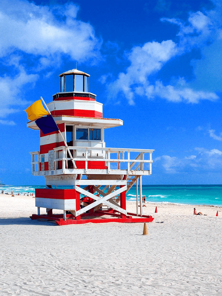 Lighthouse on beach, scenic coastal view, ocean, sky, vacation, travel, maritime navigation, seaside, summer, vacation photography.