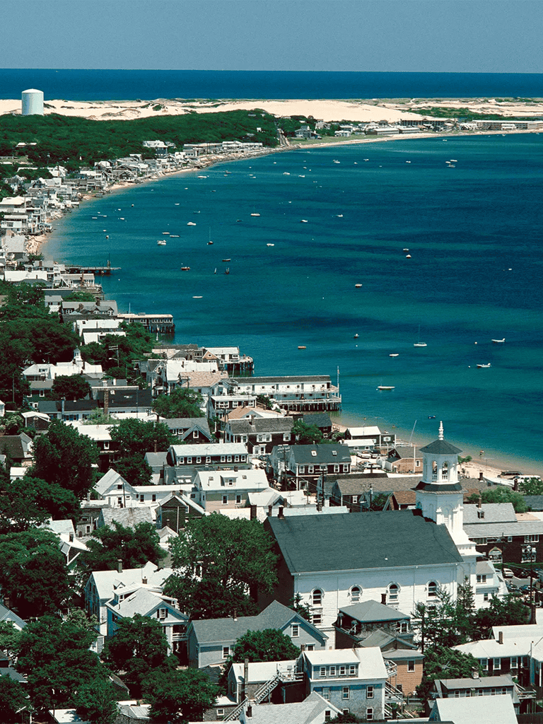 Colorful coastal town with scenic ocean views and beachside homes.