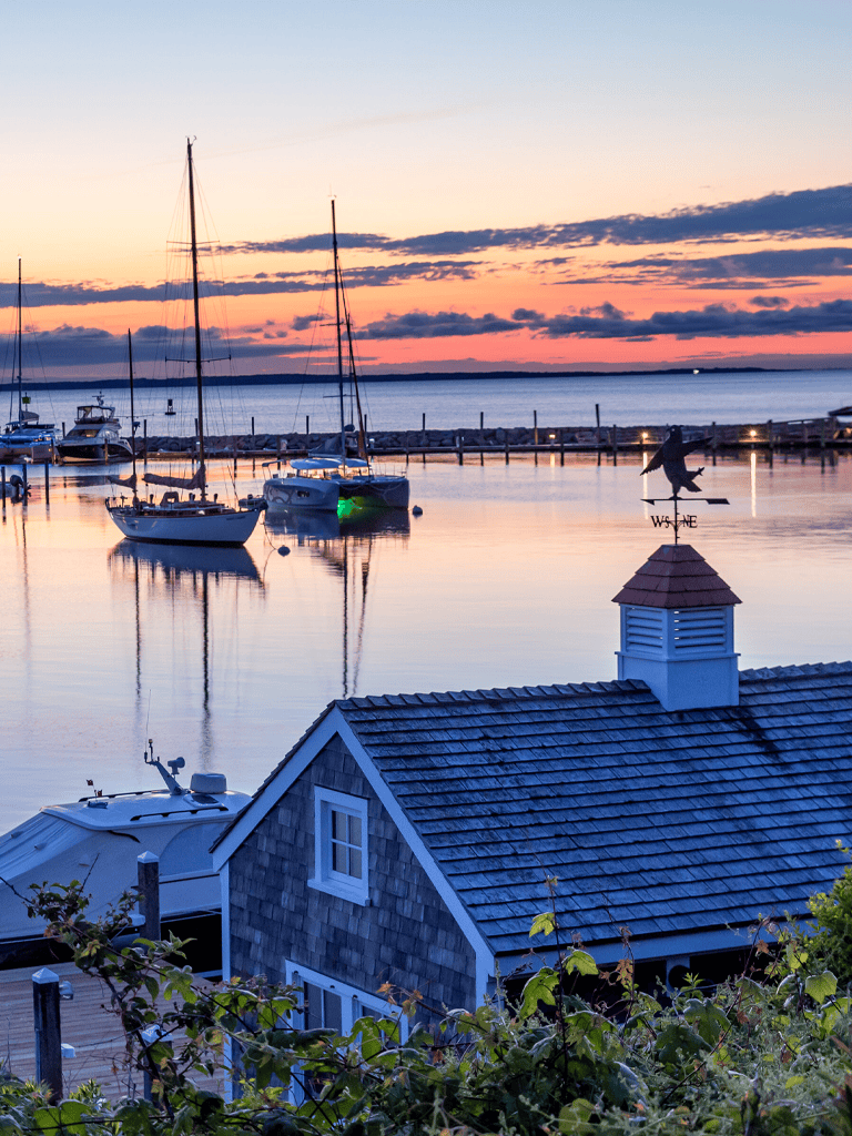 Rustic marina with sailboats at sunset, perfect for boating and sailing adventures.