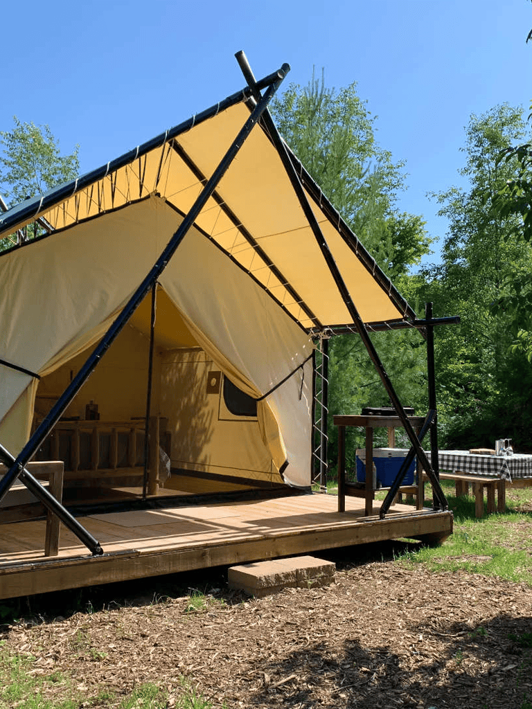 Unique glamping tent at QuestForDirections outdoor camping site.