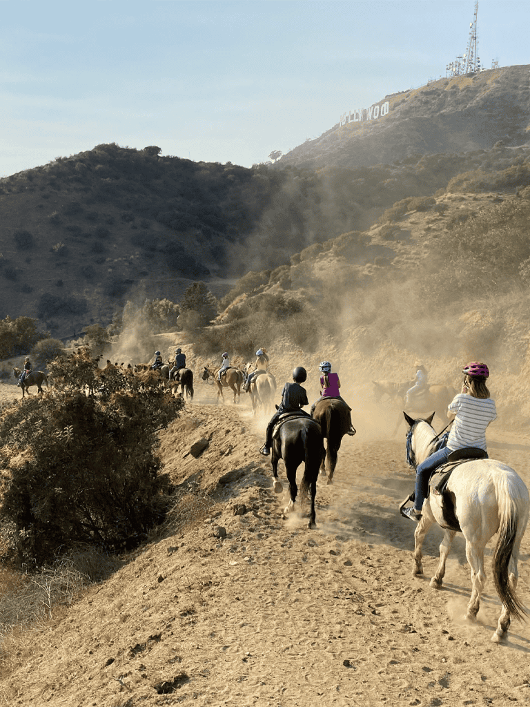 Horseback riding adventure in Hollywood Hills with scenic views and iconic landmarks.
