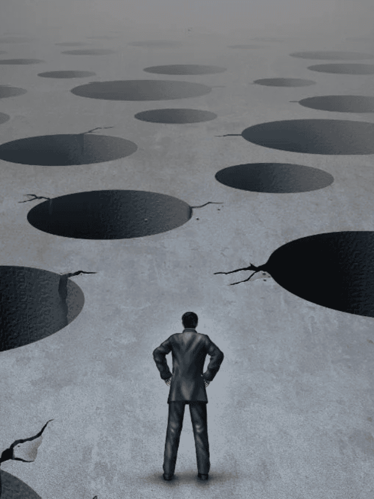 Uncertain businessman reviewing large holes in an abstract ground, symbolizing the need for strategic guidance and decision-making.