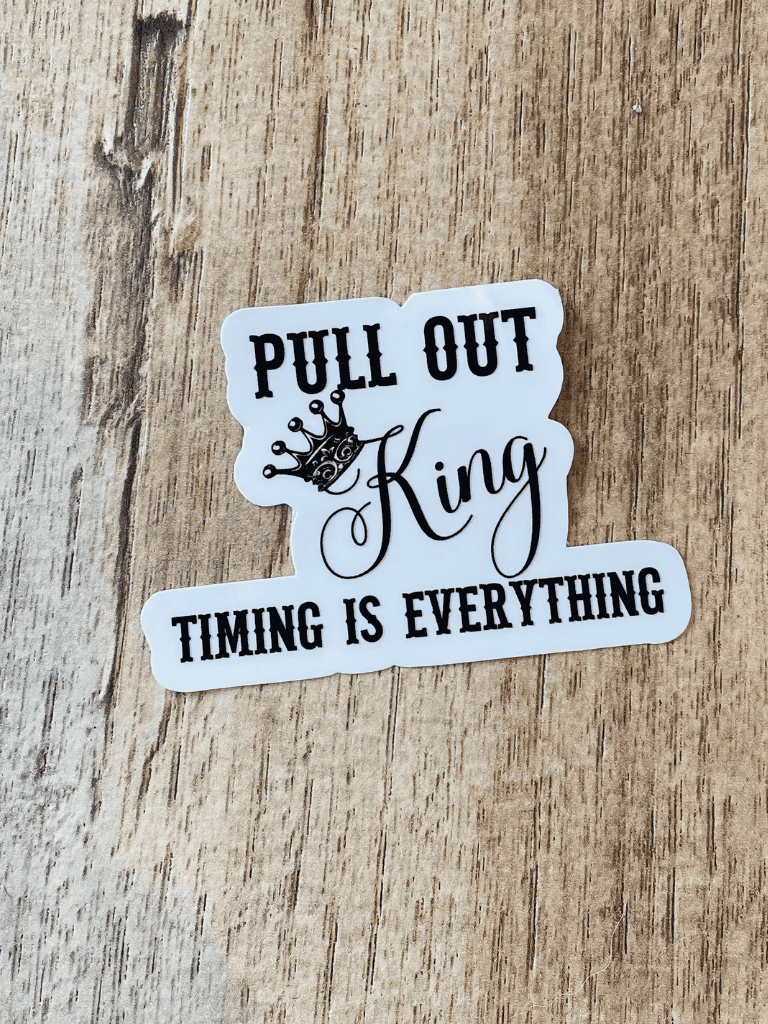 Pull out King sticker on wooden background.