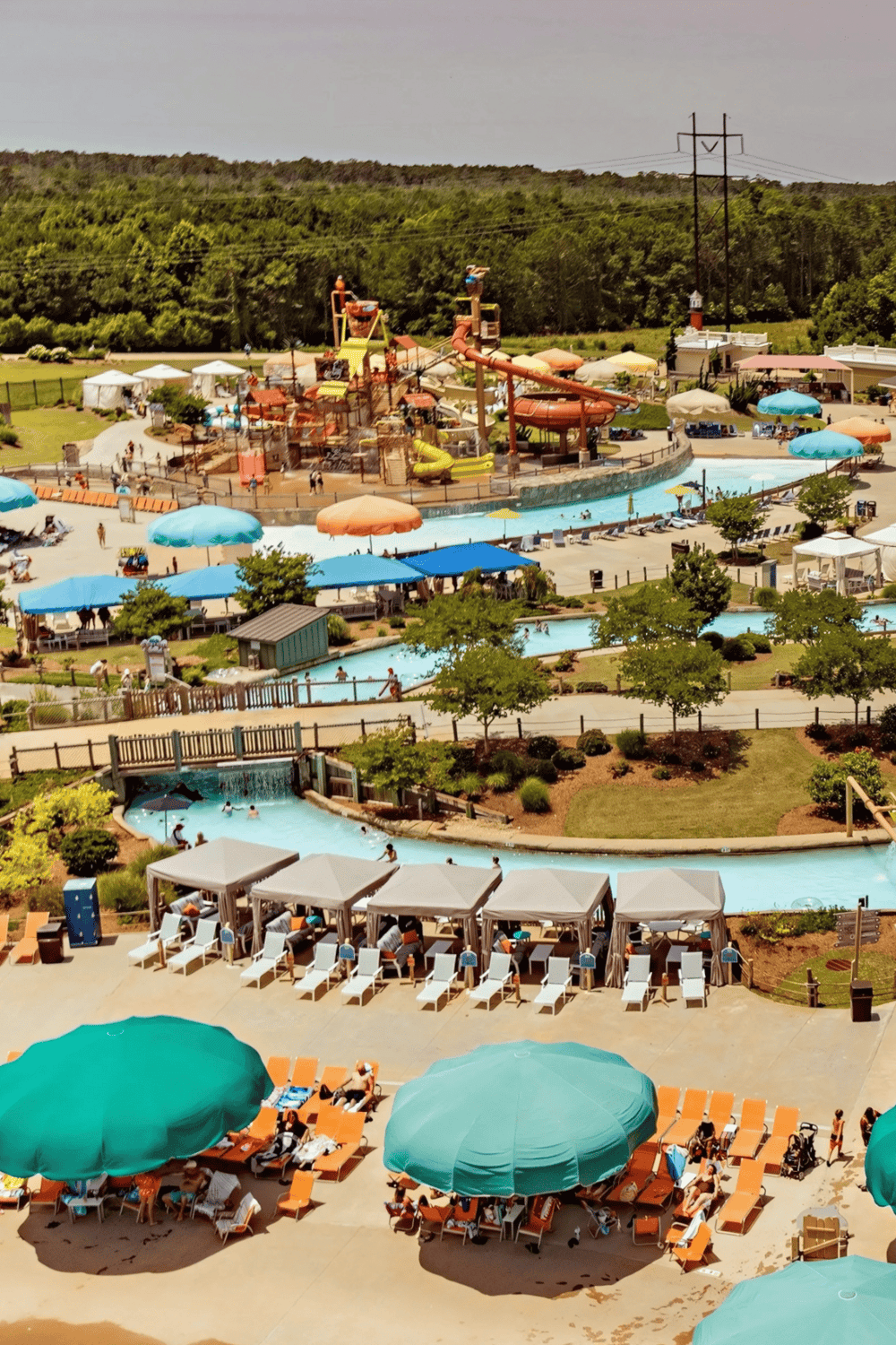 Colorful water park with slides, lazy river, and shaded lounging areas for family fun and relaxation.