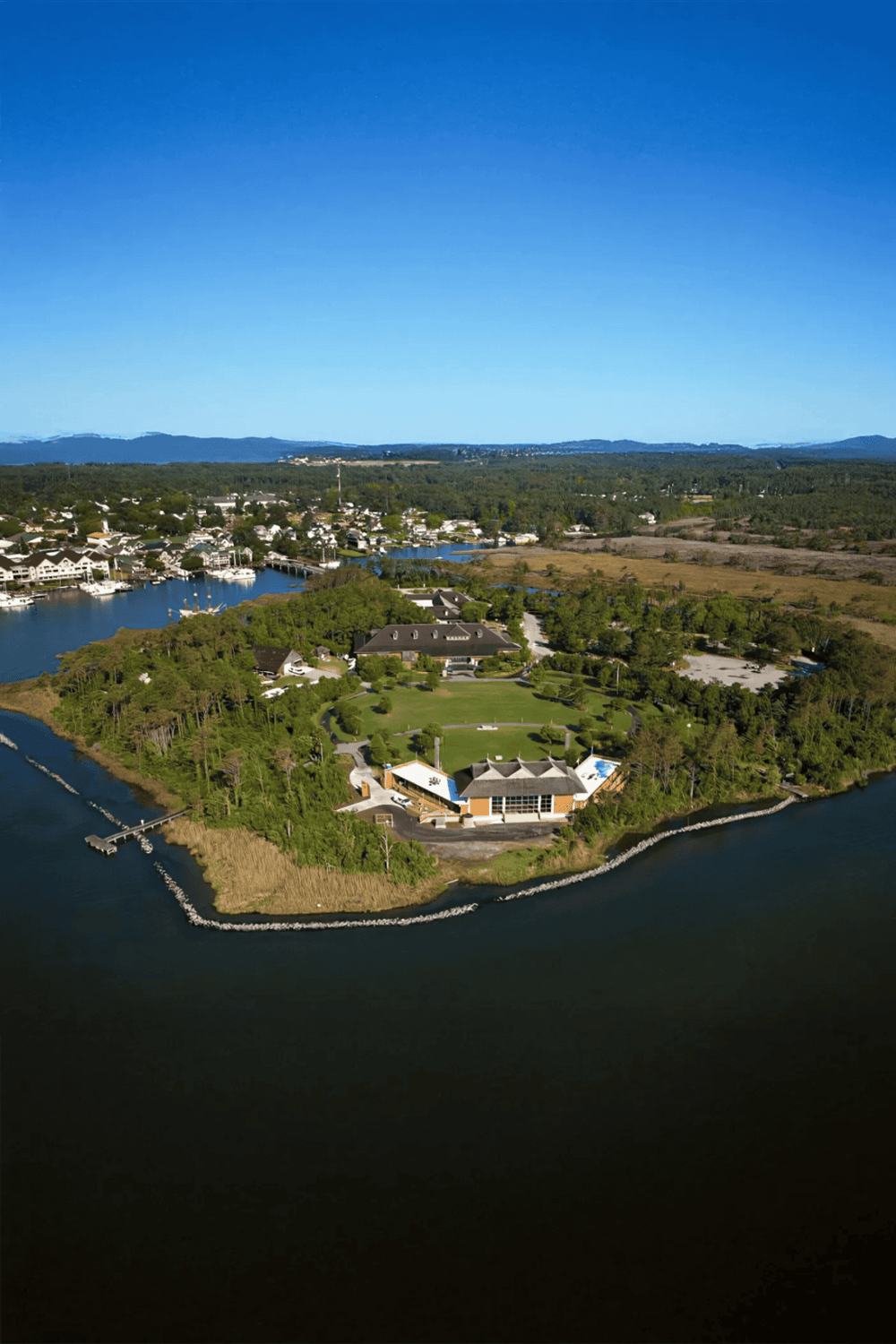 Waterfront residential community with lush greenery and scenic views.