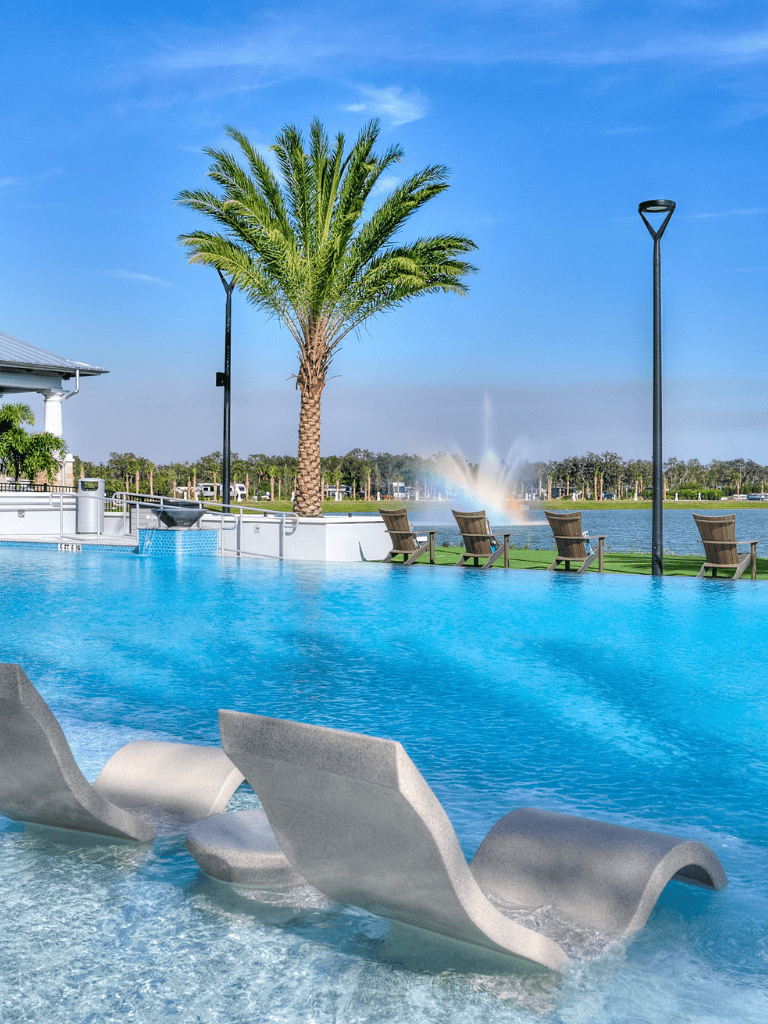 Luxurious poolside with palm trees and scenic water fountain at QuestForDirections resort in sunny Florida.