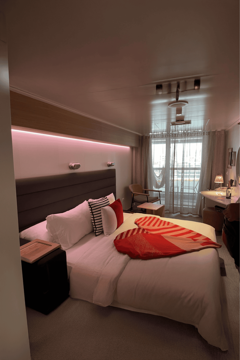 Luxurious hotel room with modern decor and cozy bed, perfect for relaxing stays.
