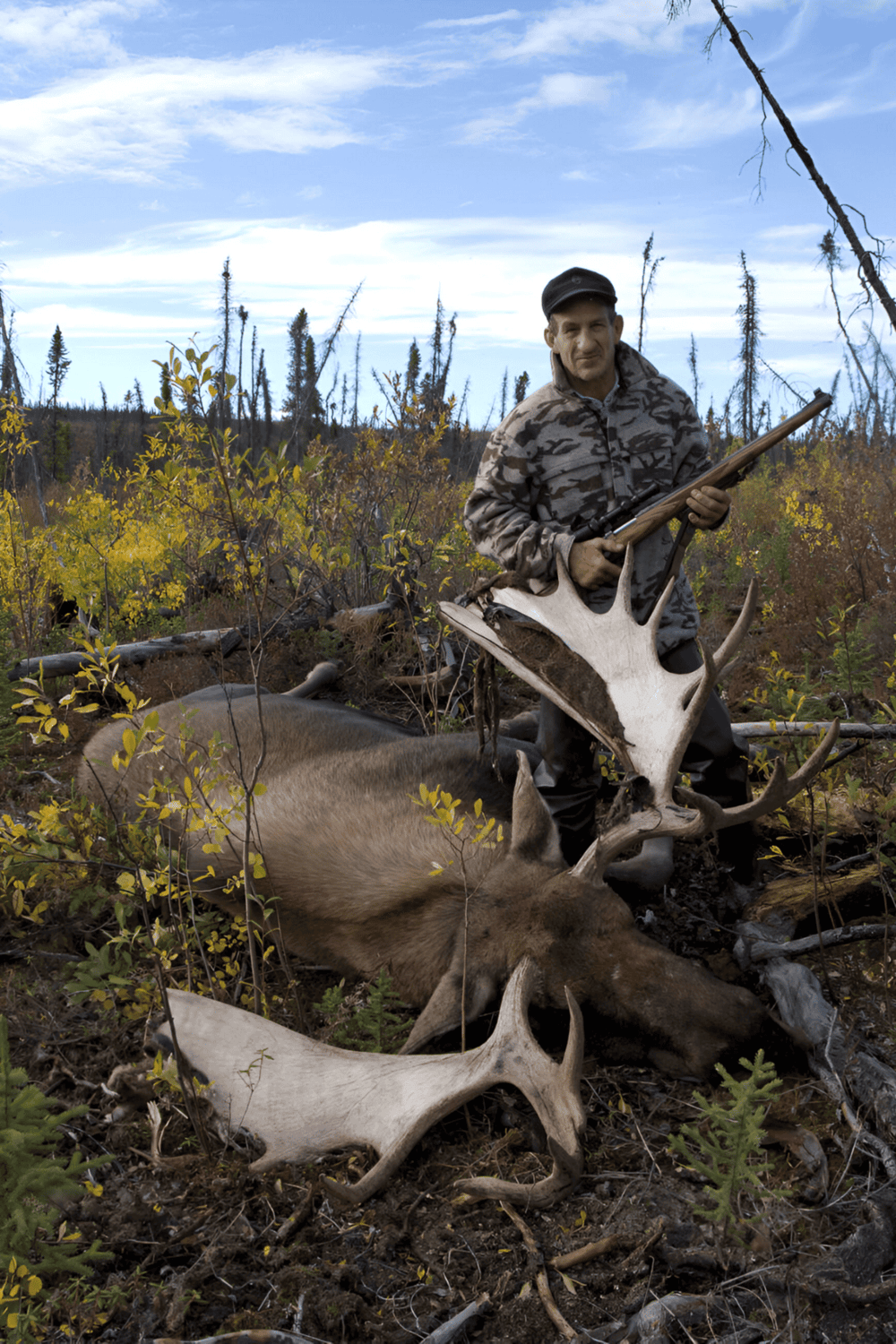Deer hunting with rifle in wilderness, hunting adventure for outdoor enthusiasts.