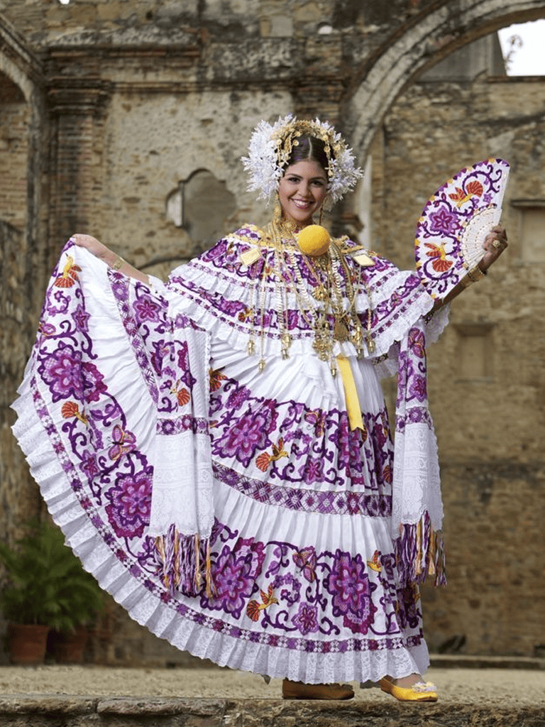Venezuelan traditional dress, colorful embroidered costume, cultural folkloric clothing, female in festive gown, Latin American attire.