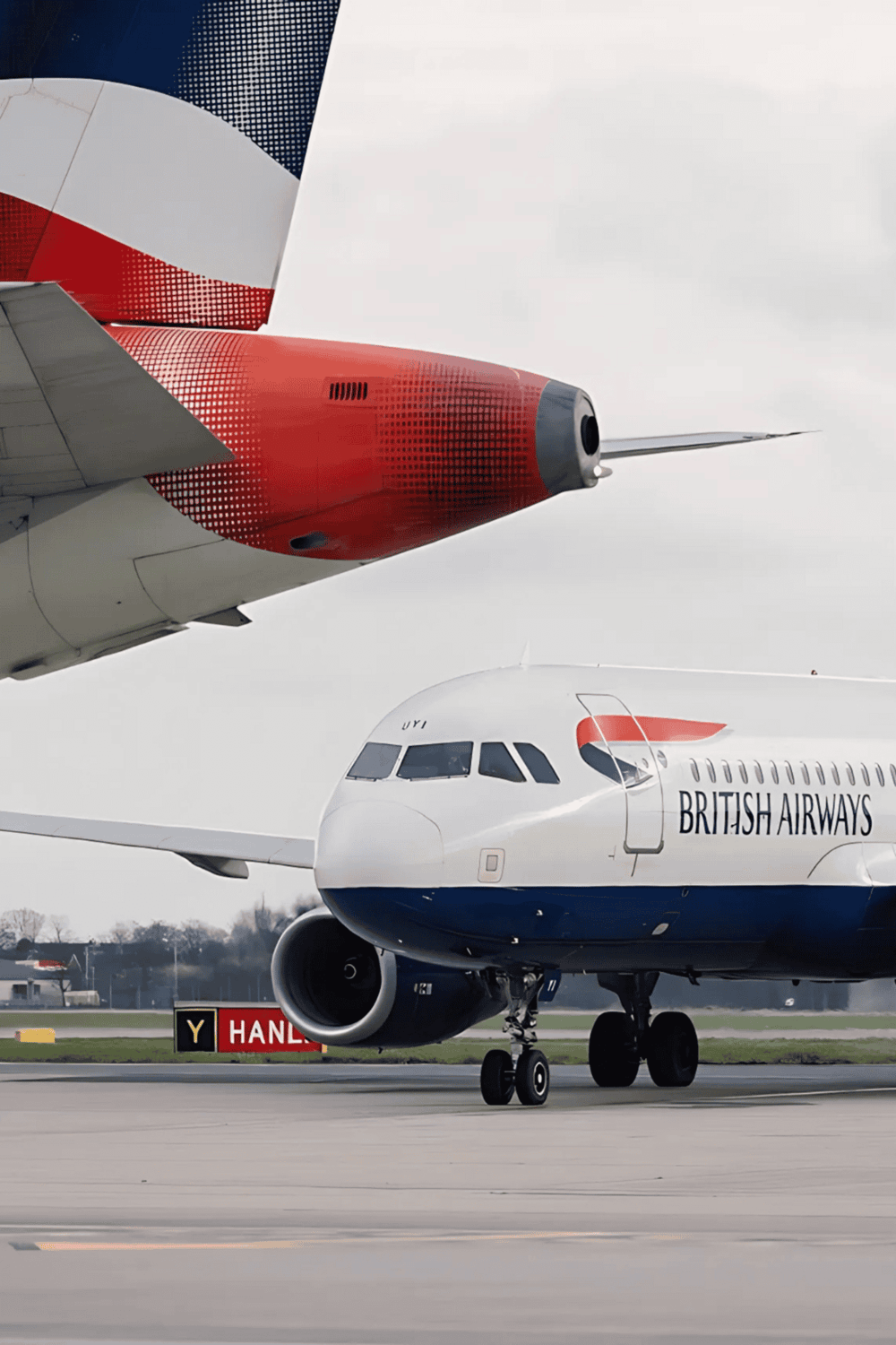 - Airplanes on runway with British Airways branding and colorful tail design.