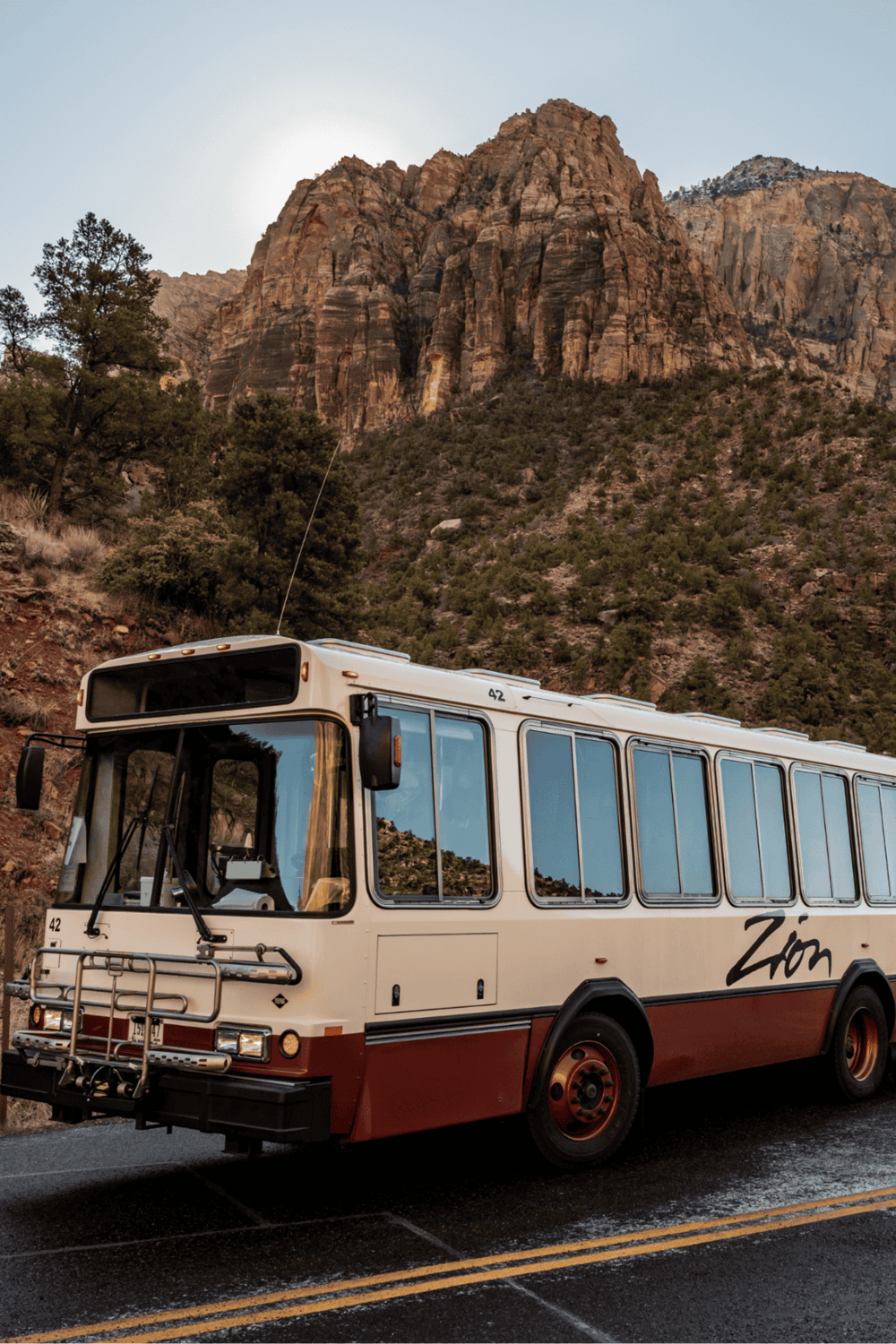 Scenic mountain tour bus at Zion National Park in Utah, offering guided tours and outdoor adventures.