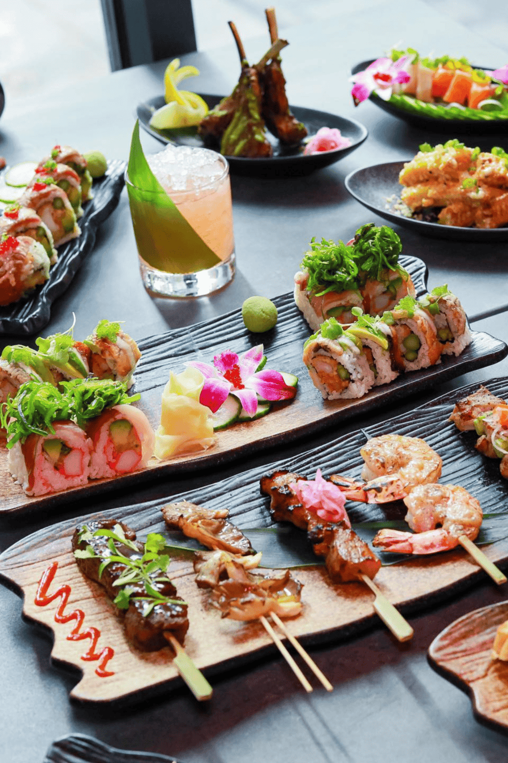 Delicious sushi platter with fresh seafood, colorful vegetables, and a variety of Asian-inspired dishes.