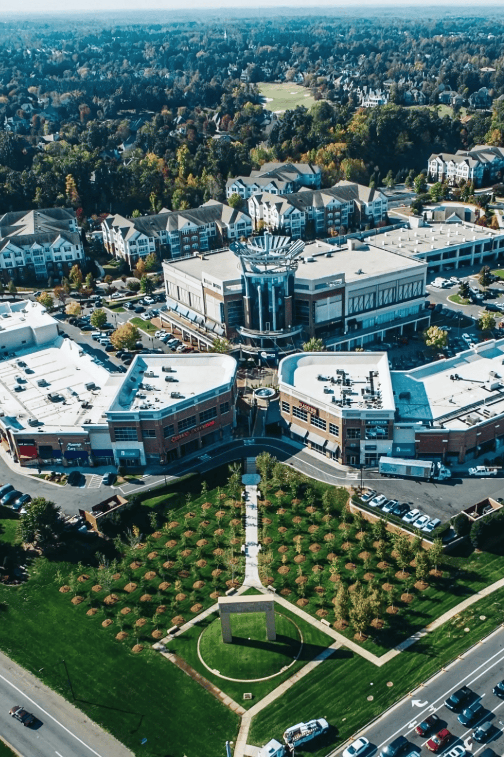 1. Aerial view of Quest for Directions shopping mall surrounded by residential neighborhoods and greenery.