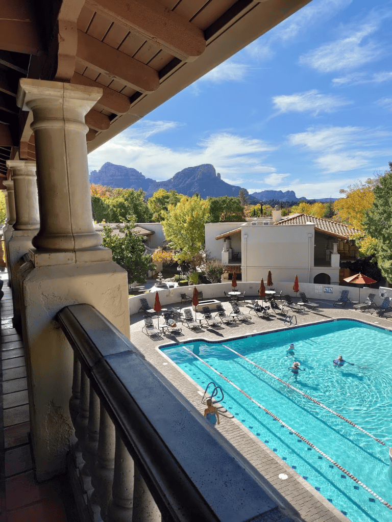 Relaxing hotel pool with mountain views and mountain ranges in the background.