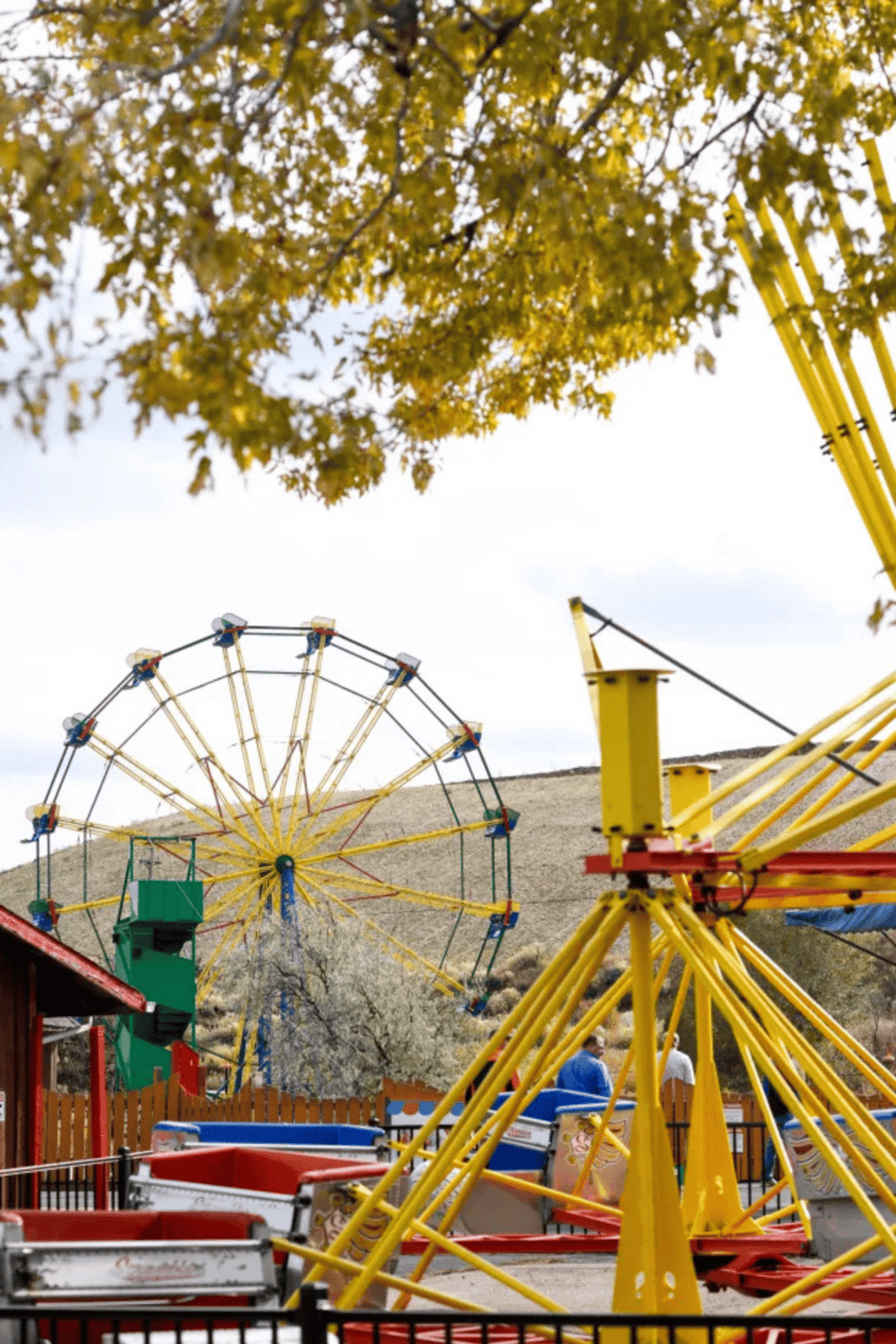 Colorful amusement park Ferris wheel and rides at QuestForDirections. Family fun activities and attractions for all ages.