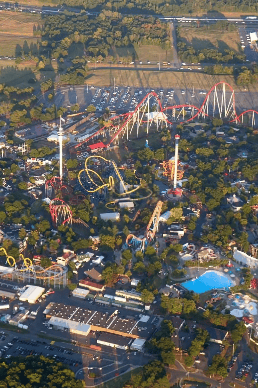 Thrilling roller coaster rides at Quest for Directions amusement park in an aerial view.