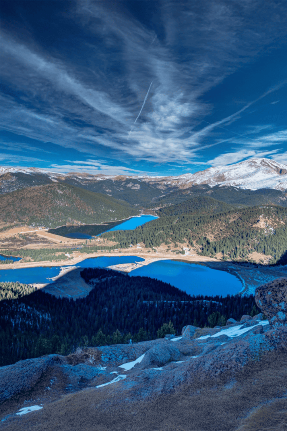 Majestic mountain landscape with lakes and snow-capped peaks, showcasing beautiful nature scenery.