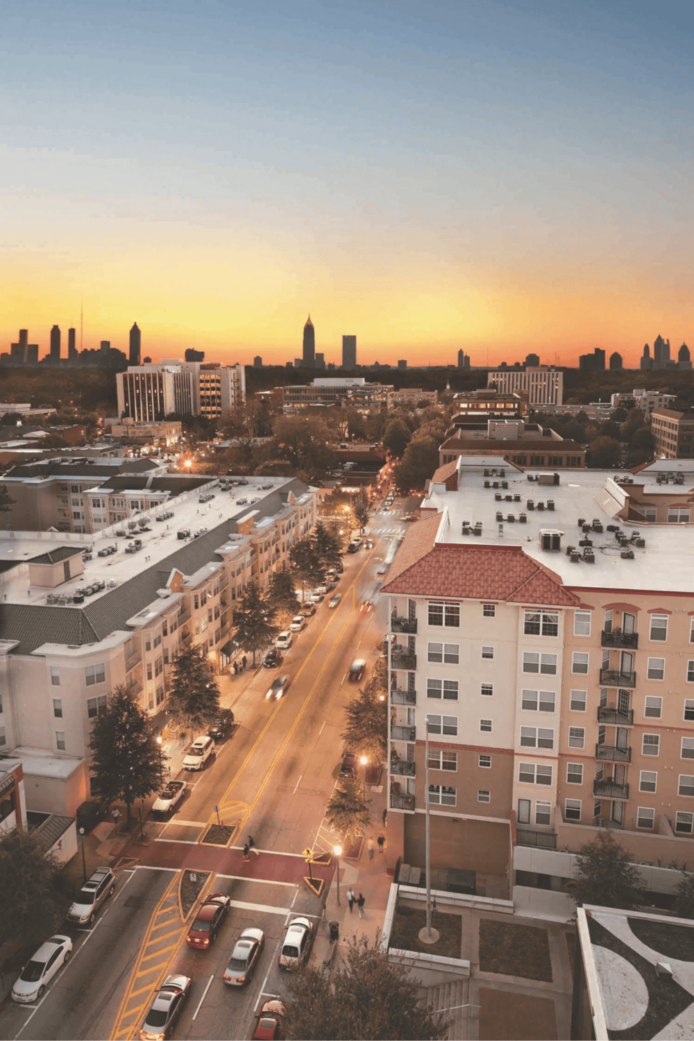 Skyline of Atlanta during sunset with city buildings and busy streets.