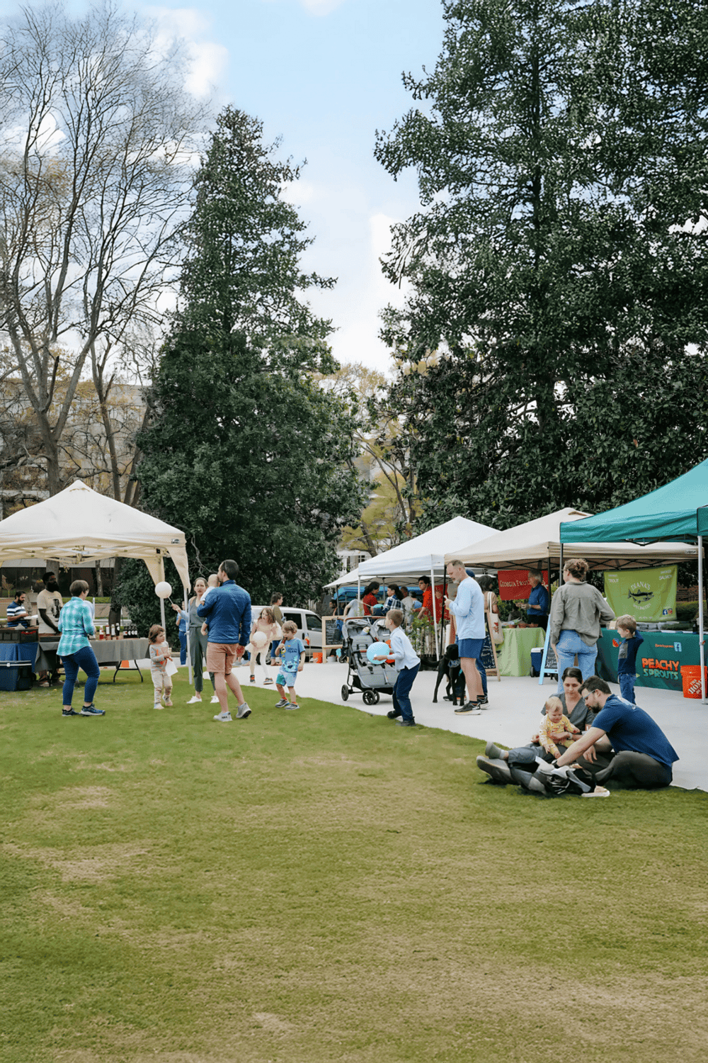 1. Outdoor farmers market with kids and families enjoying shopping and entertainment.