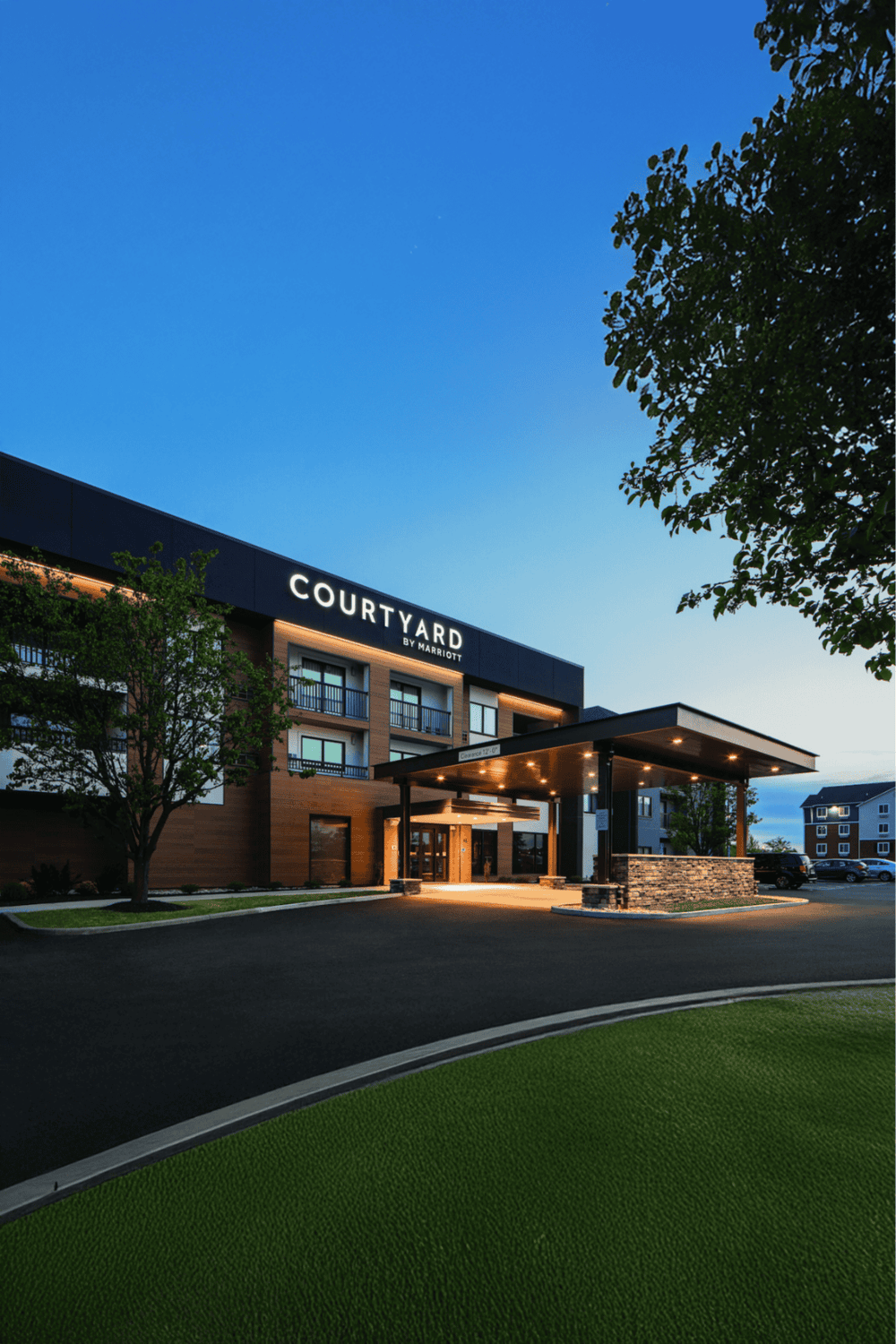 Modern hotel Courtyard by Marriott exterior at dusk, inviting and comfortable stay.