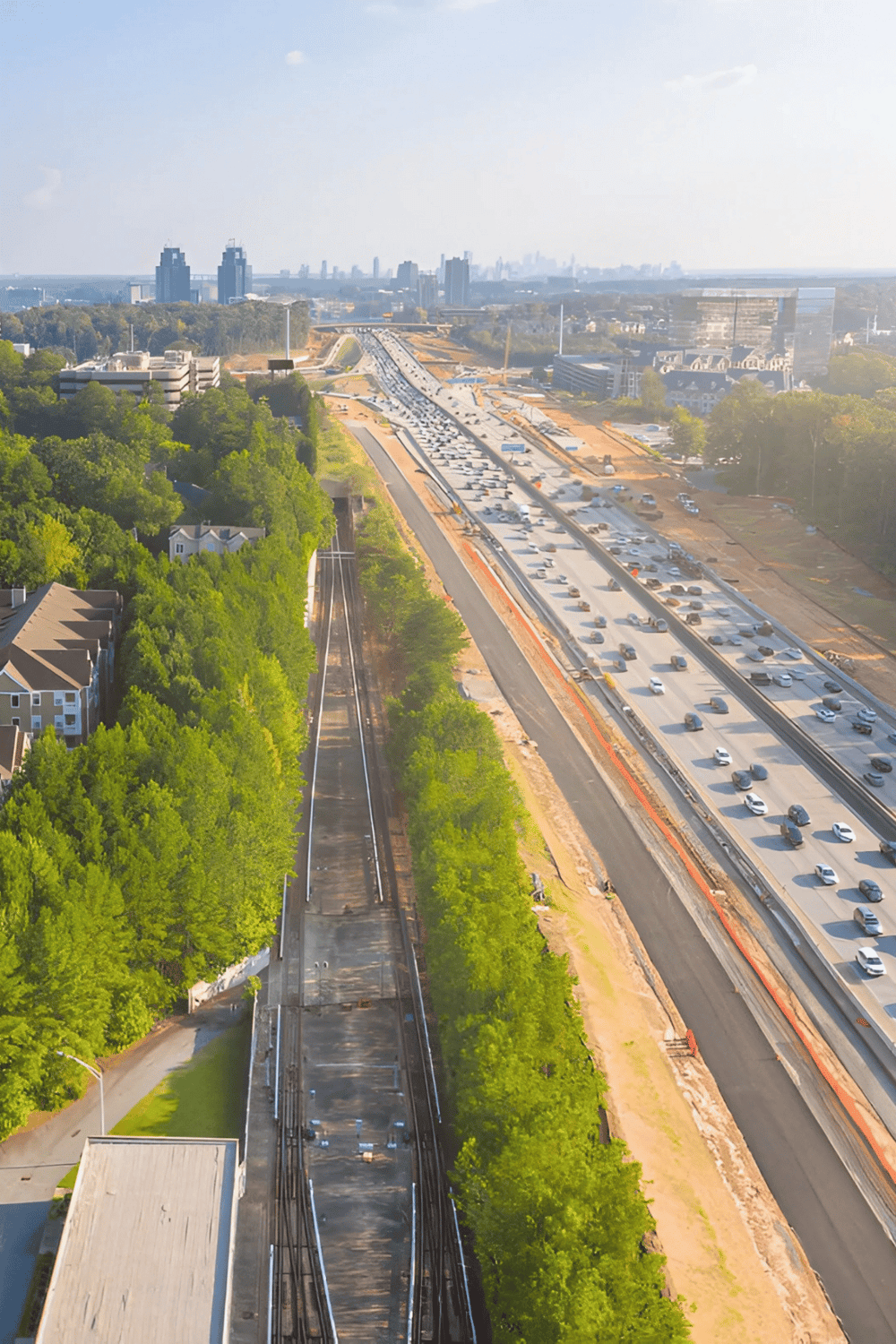 1. Aerial view of highway construction and traffic congestion in city featuring QuestForDirections.