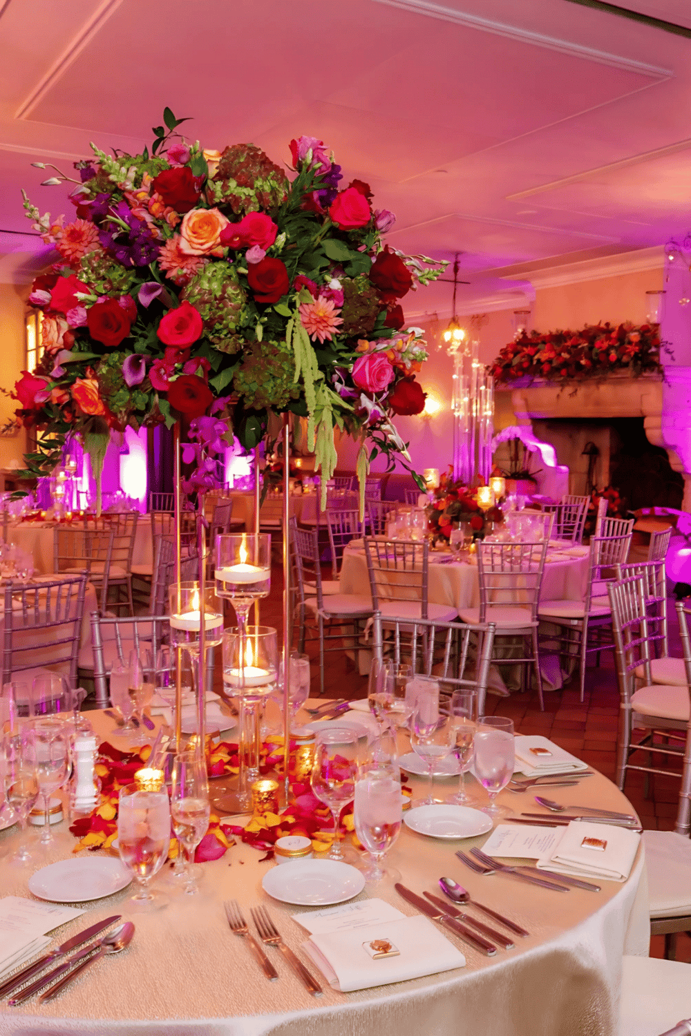 Elegant event venue with luxurious floral wedding decor and ambient lighting at QuestForDirections.