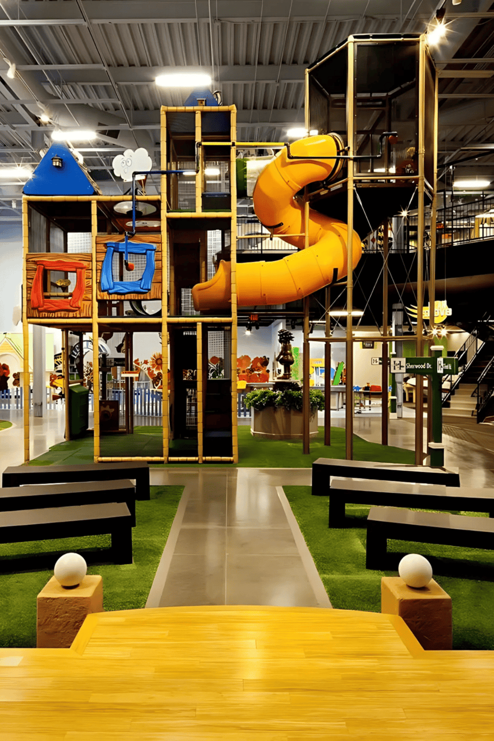 Playground indoor attraction with colorful slides and climbing structures for kids.